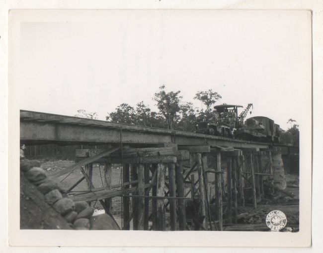 1944-12-21-jeep-train-burma-bridge1