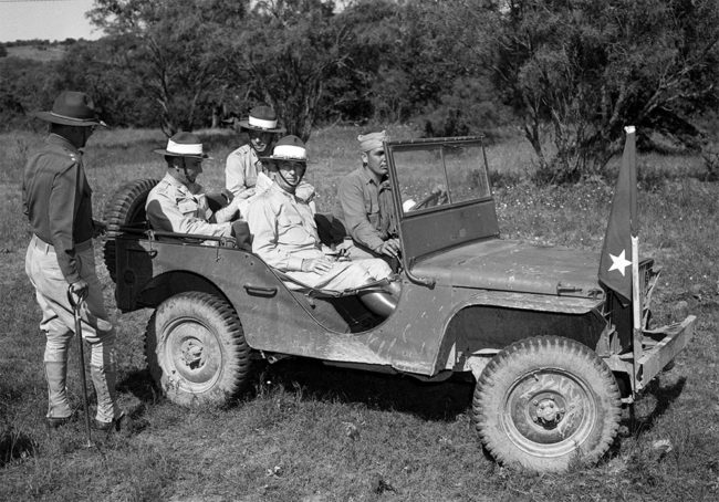 Fort Worth Star-Telegram Collection, University of Texas at Arlington Libraries. Camp Bowie Army maneuvers: Lietenant General Walter Krueger with Major General Claude V. Birkhead and others. (1941). Retrieved from https://library.uta.edu/digitalgallery-beta/img/20053219 ... Camp Bowie Army maneuvers. Four military officers and one military personnel are pictured here. Lieutenant General (LIEUT. GEN.) Walter Krueger, seated in the front passenger seat, Third Army Commander, was in the field almost as much as the participating troops. Here he's leaving 36th Division command post after a conference with Major General (Maj. Gen.) Claude V. Birkhead, division commander, standing by the baby jeep. In the rear seat are, foreground, Lieutenant Colonel (Lieut Col.) George R. Barker, Third Army G-3, and Captain (Capt.) R. H. Chard, Krueger's aid. Driver is Private (Pvt.) Harvey Belote. All are dressed in military uniforms. Published in the Fort Worth Star-Telegram morning edition, June 15, 1941.